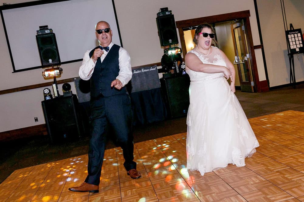 Wedding reception dance floor under colorful BT Sound lighting — gallery photo 33