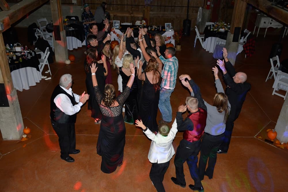 Wedding reception dance floor under colorful BT Sound lighting — gallery photo 41