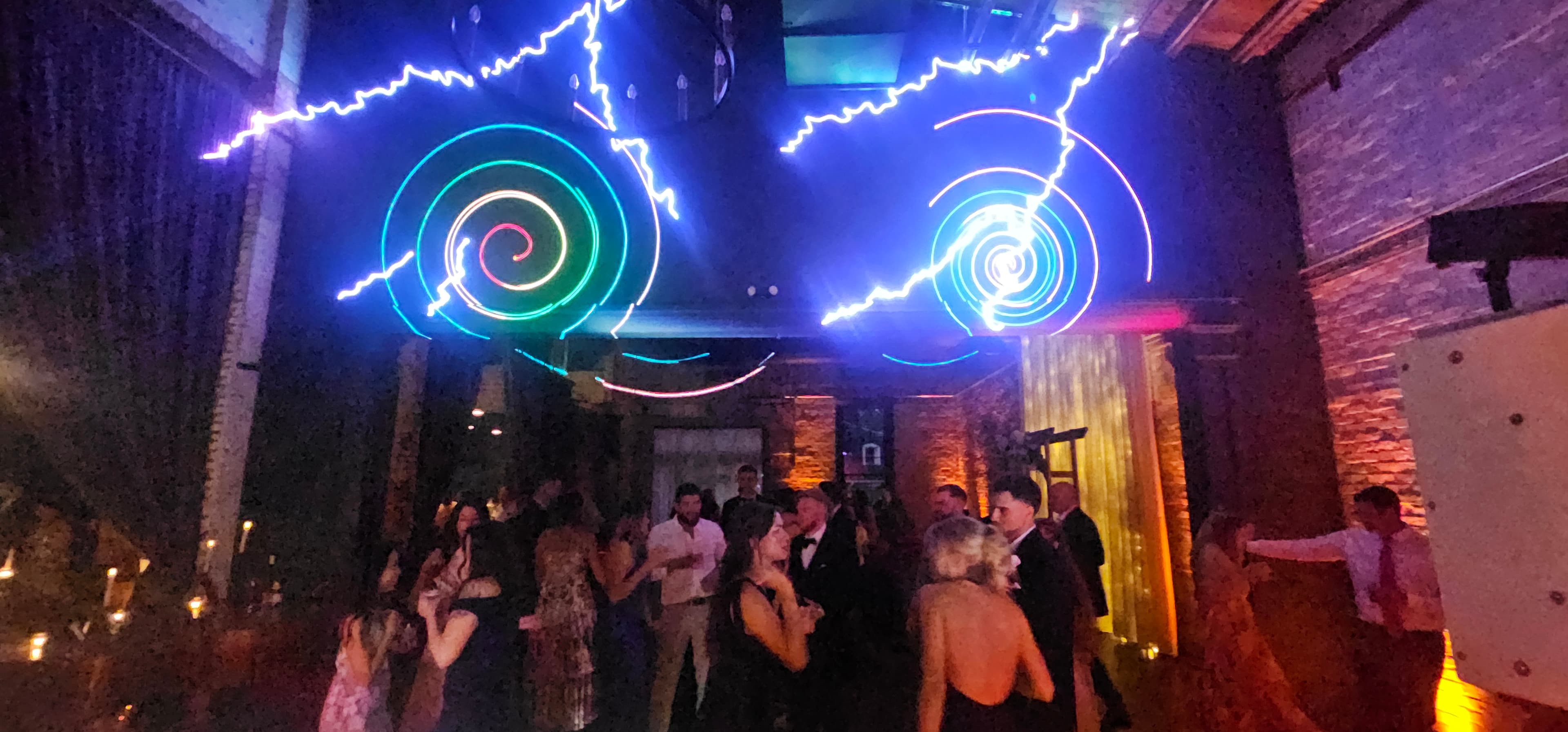 Wedding reception dance floor under colorful BT Sound lighting — gallery photo 1