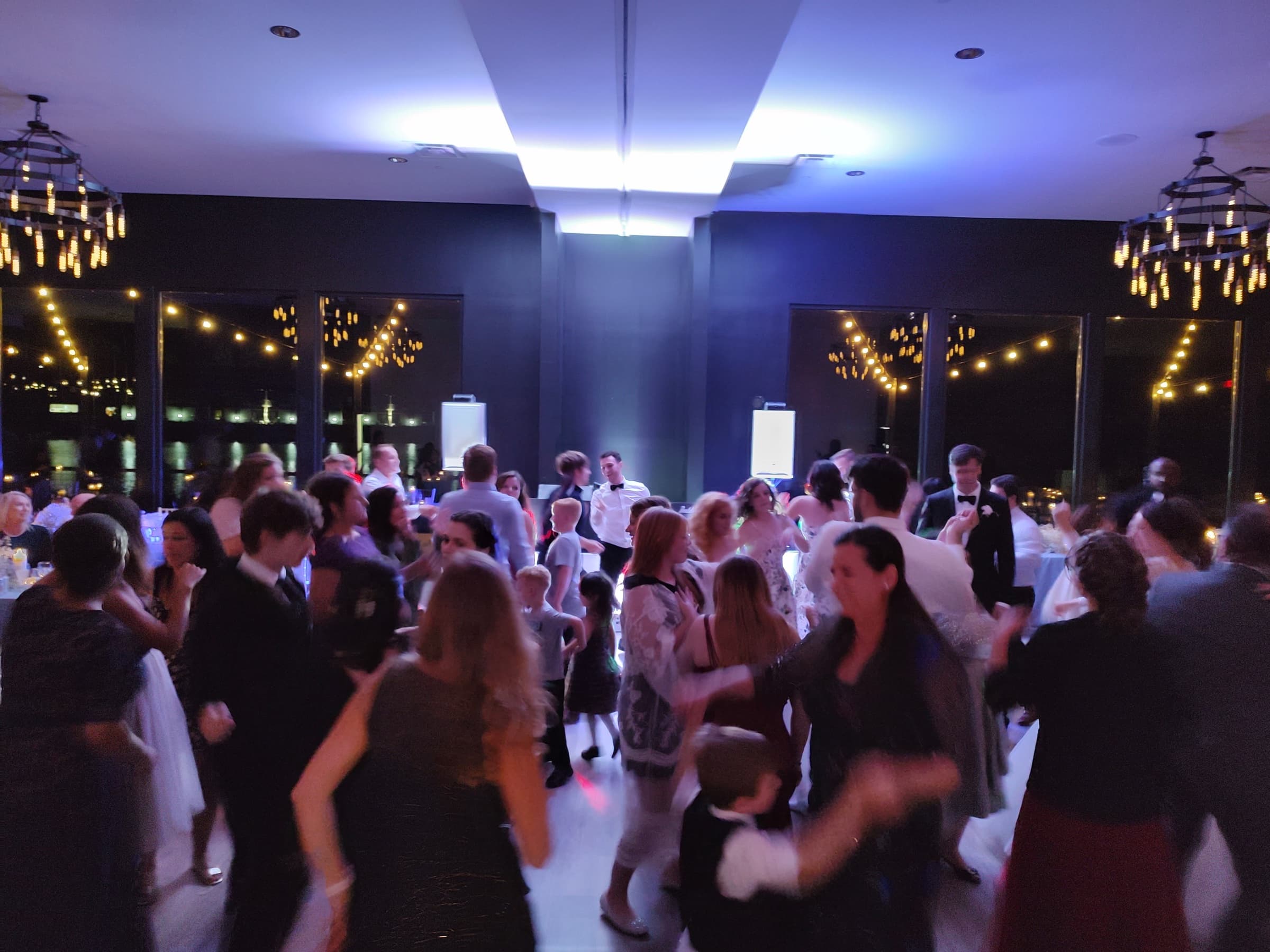 Wedding guests filling the dance floor at a modern Chicagoland reception